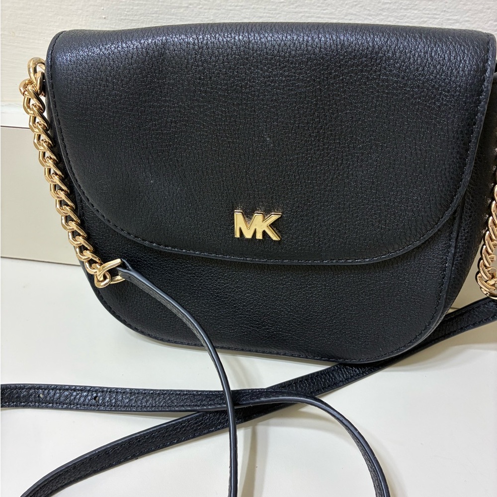 The Michael Kors Half Dome Crossbody Bag excellent condition